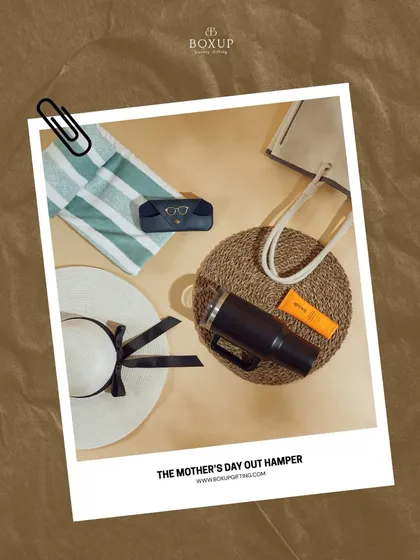 The 'Mother's Day Out' hamper is the perfect summer treat. It's packed with essentials for a day of relaxation, including a sun hat, tumbler, and sunscreen.