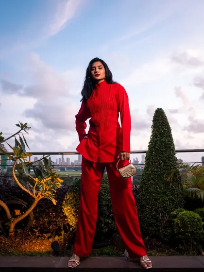 Another wide shot of the red outfit, showcasing the complete look from head to toe.