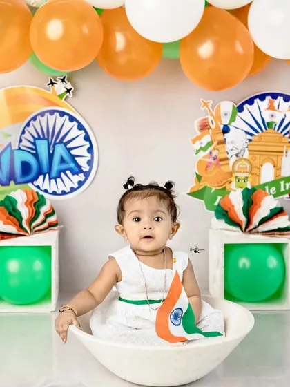 A little patriot holds the Indian flag. These sessions are a wonderful way to celebrate national holidays with your family.