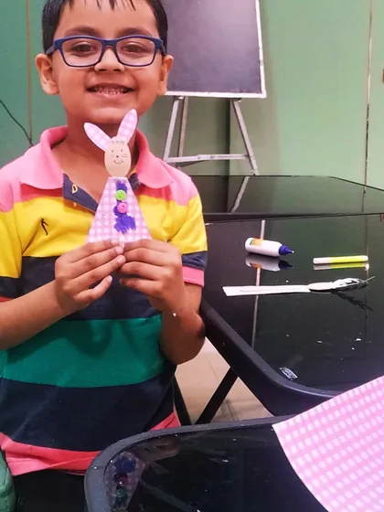 He is so proud of his finished Easter bunny puppet. It's amazing to see how a few simple craft supplies can turn into a source of such big smiles.