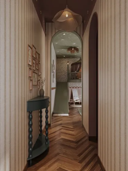 The entryway to the playroom offers a tantalizing glimpse of the fun within. An arched doorway frames the view of the slide and mezzanine, creating a sense of wonder and drawing you into this magical space designed just for children.