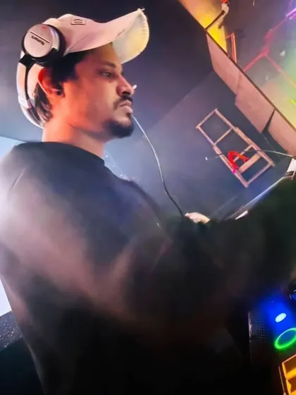 In the zone, completely focused on the music and the crowd's reaction. For me, DJing is about creating a shared experience, one track at a time.