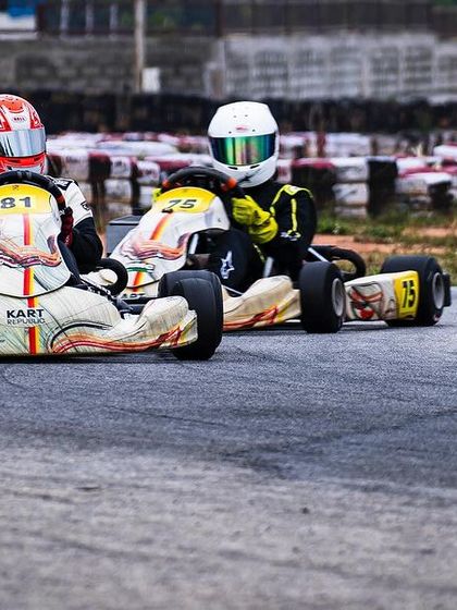 Two of our drivers battling for position, showcasing their competitive spirit.