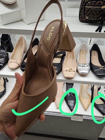 Personal shopping is part of the journey. Here, we're selecting the right footwear, focusing on pointed-toe styles that elongate the leg and add a polished finish.