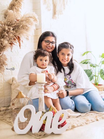 Three generations of love. This precious photo of a mother with her two daughters in a beautiful, light-filled setting is a memory they will cherish for years.