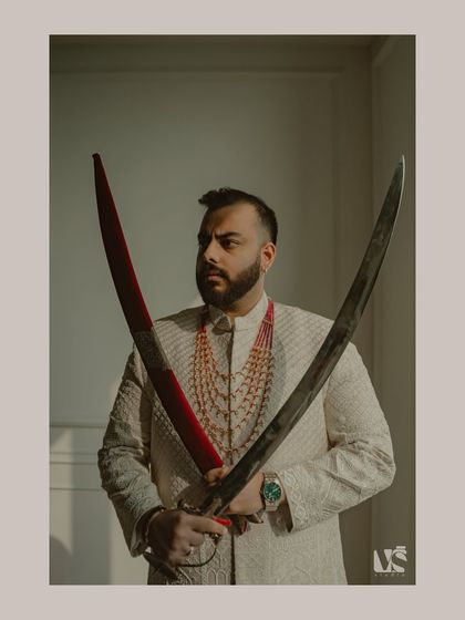 A powerful portrait of Vikash holding two swords. The composition is strong and symbolic, capturing a sense of readiness and heritage as he steps into his new role.