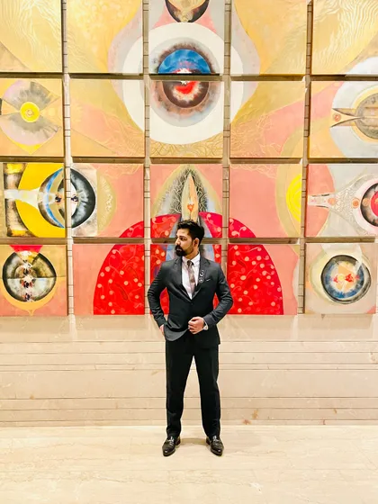 A quiet moment of reflection at an event venue. The life of a traveling artist is filled with these moments of pause, surrounded by the art and atmosphere that fuel my own creativity.