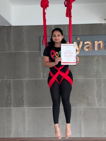 A proud moment for a newly certified aerial yoga teacher. Our course equips you to hold space for others with confidence and care.
