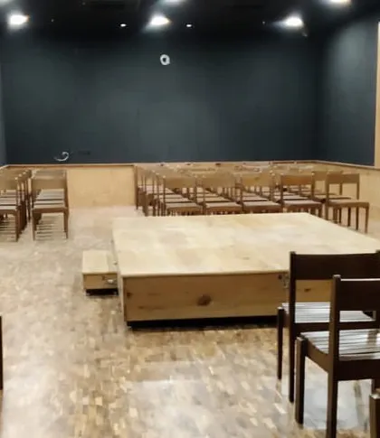 Another view of the Black Box Theatre, ready for a performance. The design focuses on functionality while retaining the large heritage windows.
