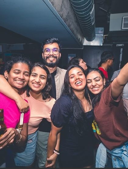 A group of friends having a great time at the Christmas party. The holiday season is all about celebrating together.