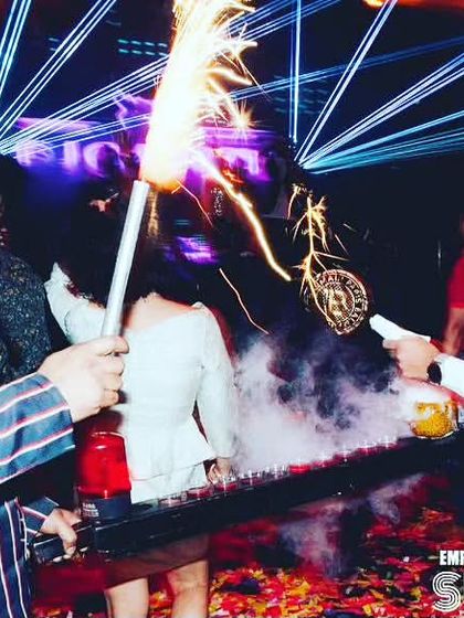 We combine smoke and fire for maximum effect. A bartender uses a smoke gun to infuse a drink while another lights a sparkler, creating a multi-sensory experience for guests.