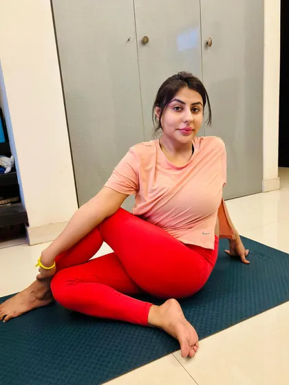 A student demonstrating a beautiful Ardha Matsyendrasana (Half Lord of the Fishes Pose) during a home session. This seated twist is excellent for improving spinal mobility and aiding digestion.