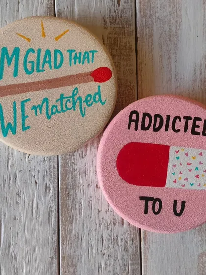 Quirky and fun magnets for your special someone. "I'm glad that we matched" and "Addicted to U" are playful, hand-painted tokens of affection.