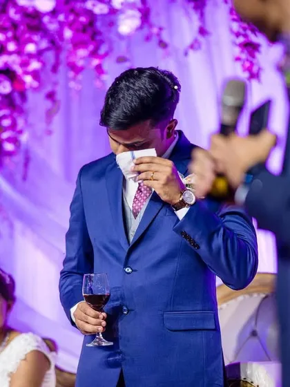 The best man gets emotional during his speech, a moment of heartfelt friendship and love. Capturing these candid reactions from guests is a key part of the story.