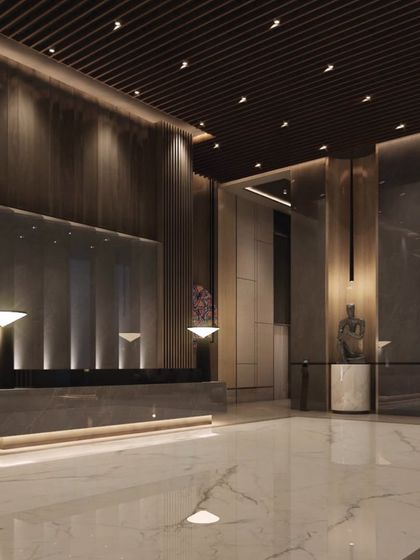 This render of the One Marina lobby highlights its dramatic scale and minimalist elegance. The dark, reflective surfaces and carefully placed lighting create a space that feels both expansive and intimate.