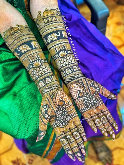 A classic full bridal design, rich with traditional motifs. This piece includes detailed peacock figures, royal elephants, and architectural dome patterns for a truly majestic look.
