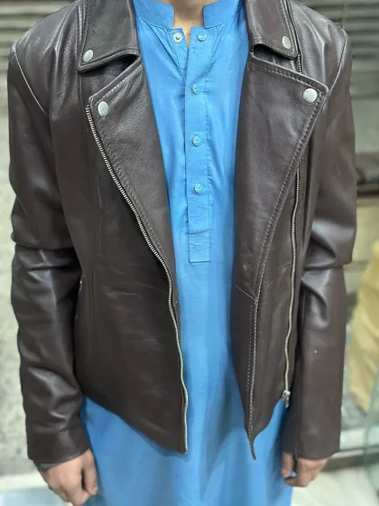 This is a genuine leather biker jacket from my Karachi shopping trip. I check the quality myself to make sure the fit and feel are just right, offering timeless styles for both men and women.