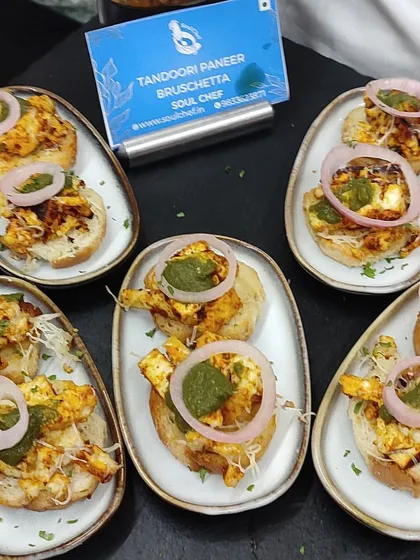 Tandoori Paneer Bruschetta, an Indo-Italian fusion appetizer that combines the smoky flavor of tandoori paneer with the crispness of bruschetta.