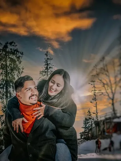 A joyful piggyback ride during a golden hour sunset in a snowy landscape. These candid, fun moments are essential for telling the complete story of your relationship.