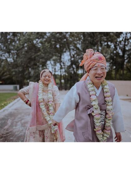 A joyful shot of the bride and her father walking and laughing together after the ceremony.
