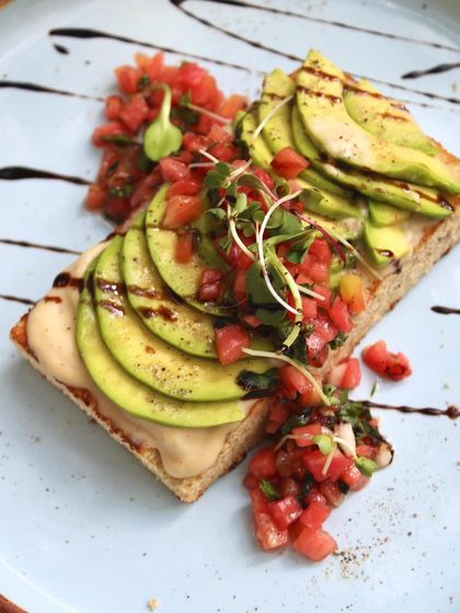 Another beautiful shot of our Open Avocado Toast, a perfect blend of Lebanese and Mexican cuisines on a slice of our freshly baked focaccia.