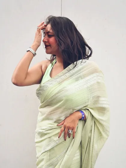 A more artistic, candid pose. The wind in my hair, the elegant drape of the saree, it all adds to the mood.