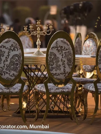 We focus on quality and design in every element. These beautiful chairs feature intricate gold frames and elegant paisley-patterned upholstery, providing a luxurious seating experience for your guests.