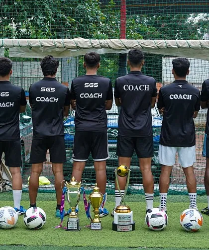 The backbone of our success. Our licensed coaches stand united, guiding our players with expertise and passion. Their dedication is reflected in the trophies at their feet.
