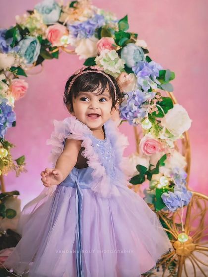 Every little girl deserves a Cinderella moment. This beautiful studio setup with a floral carriage and a stunning lavender dress creates a fairytale portrait she will always treasure.
