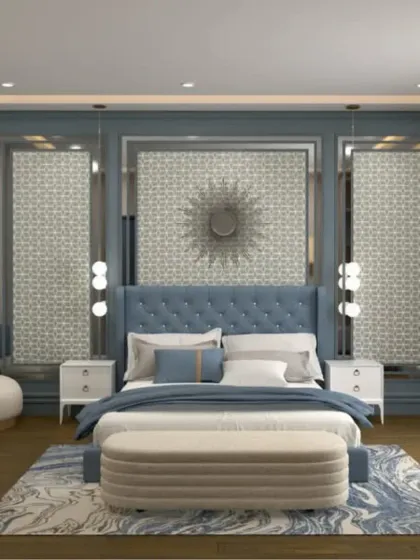 The tufted blue headboard is flanked by two decorative panels with a geometric pattern, creating a grand and symmetrical focal point in the room.