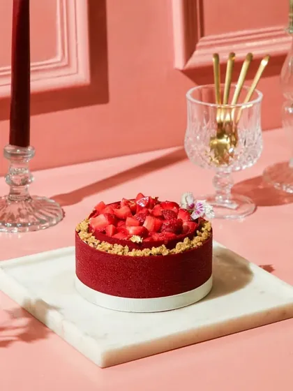 Elevate your dessert table with our Red Velvet Strawberry cake, a beautiful creation with layers of sweetness and love.