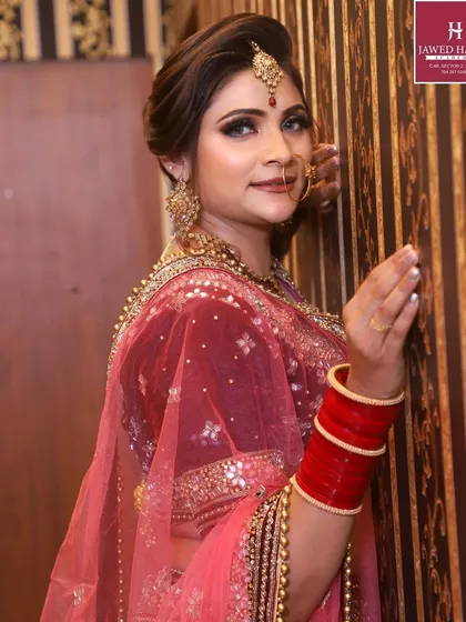 A side profile of a bride from our international bridal makeup masterclass, showcasing the elegant hairstyle and makeup.