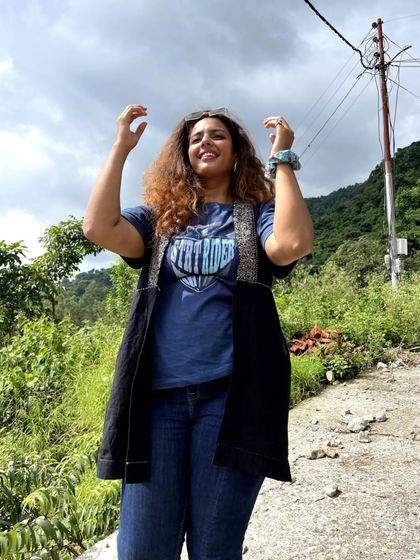 A casual hiking or travel look. I layered a jacket over a graphic tee and jeans. I even borrowed this t-shirt from the men's section, proving that style has no rules.