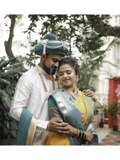 An artistic, moody portrait of the couple, capturing a quiet and intimate moment.