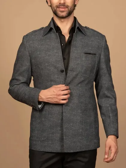 A full view of the grey shacket, showing its relaxed fit and practical pocket details. It's the perfect blend of a shirt and a jacket.