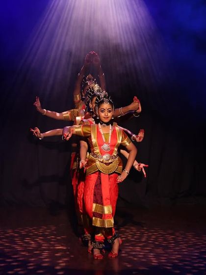 A powerful moment from our "Narasimha Kavuthuvam" piece. The illusion of multiple arms is created by the precise alignment of several dancers, showcasing our innovative choreography.