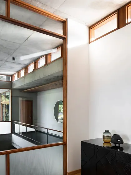 Clerestory windows and interior glazing allow light to travel deep into the home, creating connections between different rooms and levels.