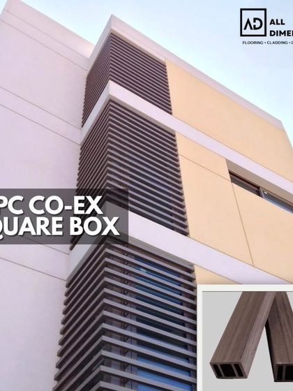 A vertical installation of WPC co-ex square box louvers on a modern building facade. This application breaks the monotony of a plain wall, adding architectural interest and a contemporary finish.