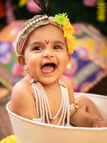 Look at that pure, unfiltered joy! My themed festival sessions, like this Janmashtami shoot, are all about creating a vibrant, playful space for your little ones to shine.