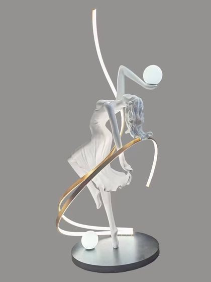We capture movement and grace in this unique floor lamp. The sculpture of a dancing figure is intertwined with a ribbon of light, creating a sense of fluid motion and turning a simple corner into a stage for art.