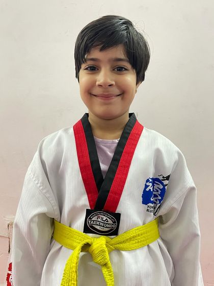 This young student is all smiles with her medal. We celebrate every victory, big or small, as a major accomplishment.