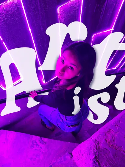 Just an artist, finding my way through color and canvas. This image captures the vibe of being lost in a world of creativity, surrounded by the purple glow of inspiration.