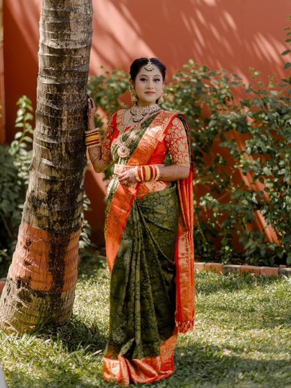 This bride looks absolutely regal. Her choice of a traditional green and red saree is perfectly complemented by my rental temple jewellery set.