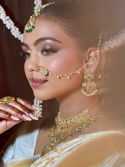 Another shot of my modern South Indian bride, showcasing the intricate jewelry and the way the makeup complements the entire look.