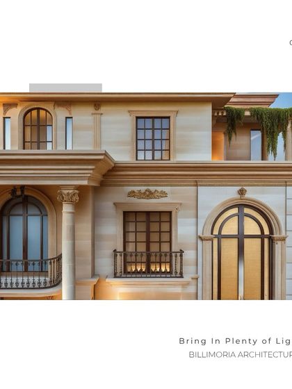 A detailed view of the building's facade, showcasing the classical architectural elements like columns, arched windows, and intricate railings. The use of natural stone gives the home a grand and timeless quality.