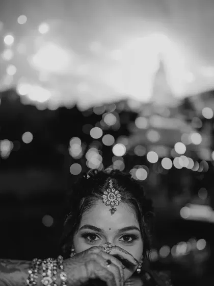 A bride's eyes hold a universe of dreams. This artistic black and white portrait focuses on the emotion and anticipation, creating a timeless image that speaks volumes without a word.