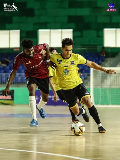 A player battling for the ball in the third group stage match.