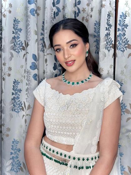 A confident portrait showcasing the modern and elegant white lehenga look.