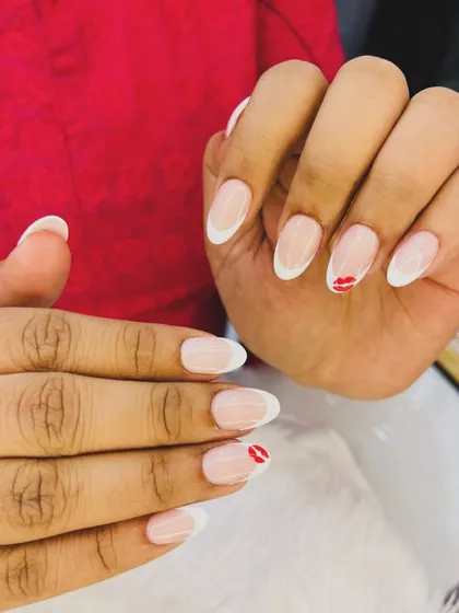 A classic with a playful twist. We gave this timeless French manicure an update with a tiny, hand-painted red lip accent nail. It’s a subtle but fun way to express your personal style while keeping your nails looking clean and elegant.