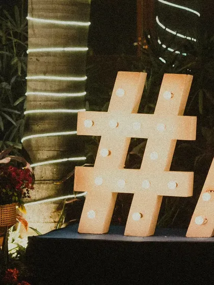 Personalization is key. I use large marquee letters to display the couple's wedding hashtag, creating a fantastic photo opportunity and a modern, trendy decor element.